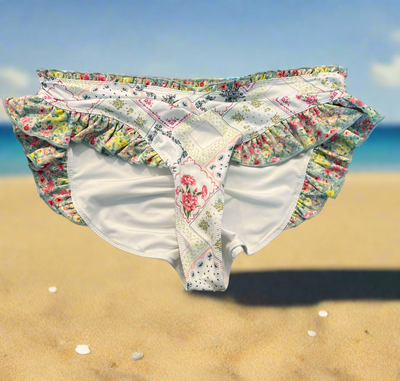 Love Shack Fancy ruffle bikini bottom, floral, size large, new condition, beach background.